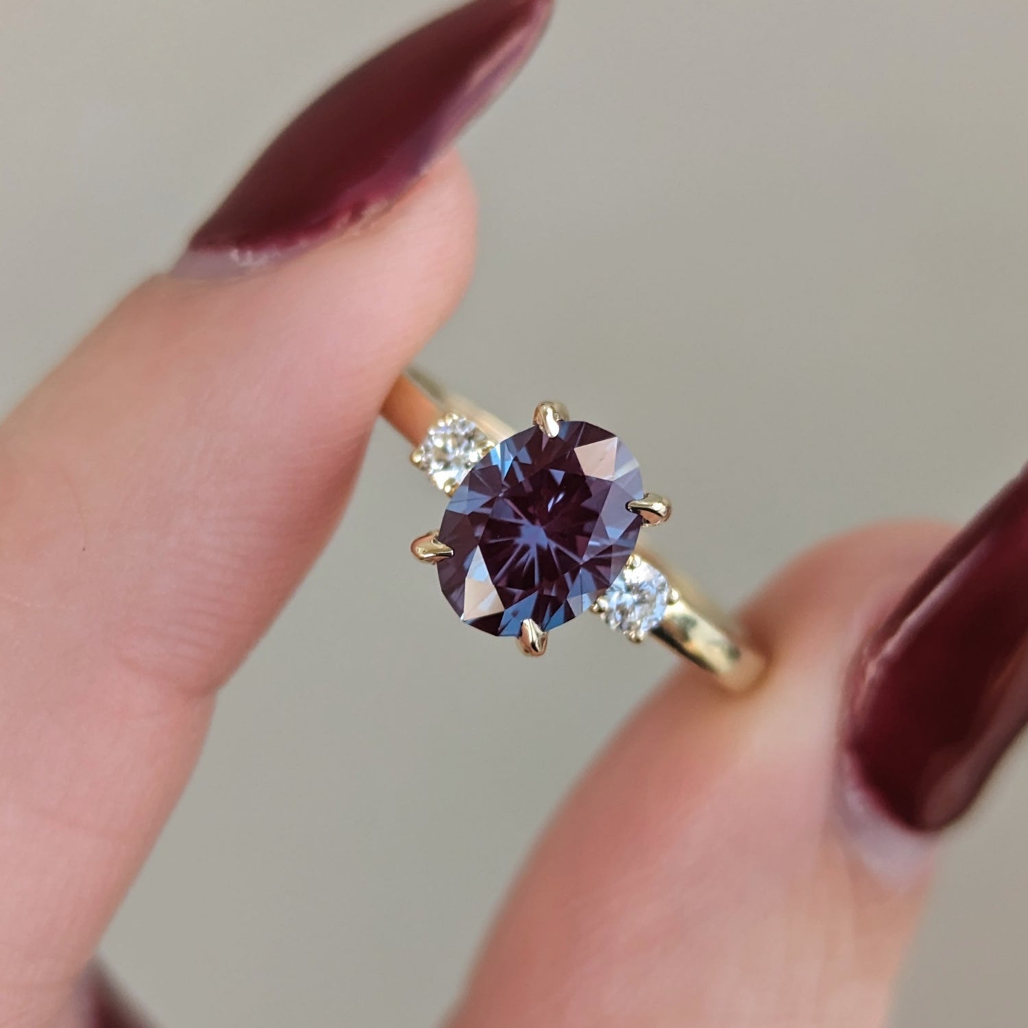 three stone ring with oval lab alexandrite