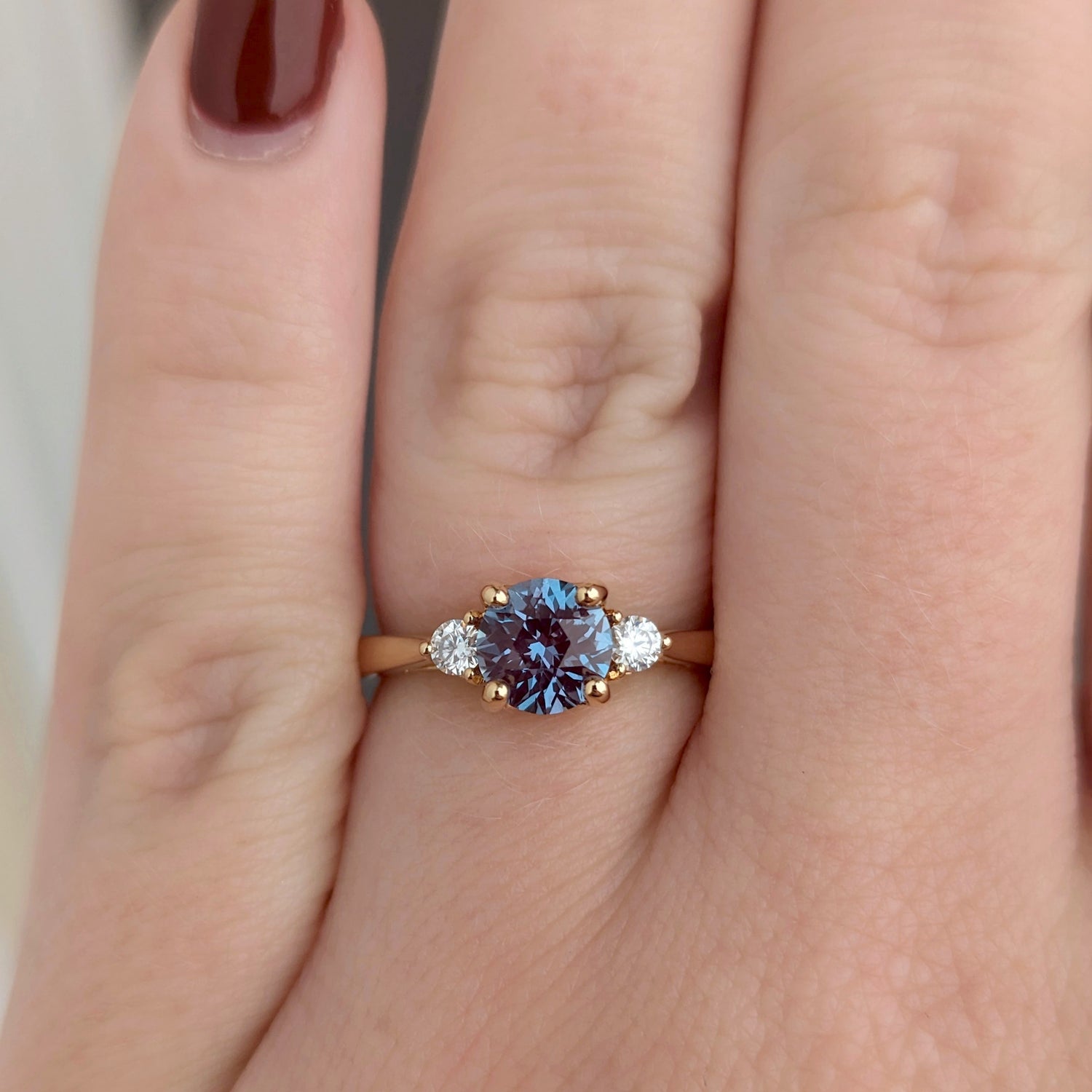 three stone engagement ring with lab alexandrite