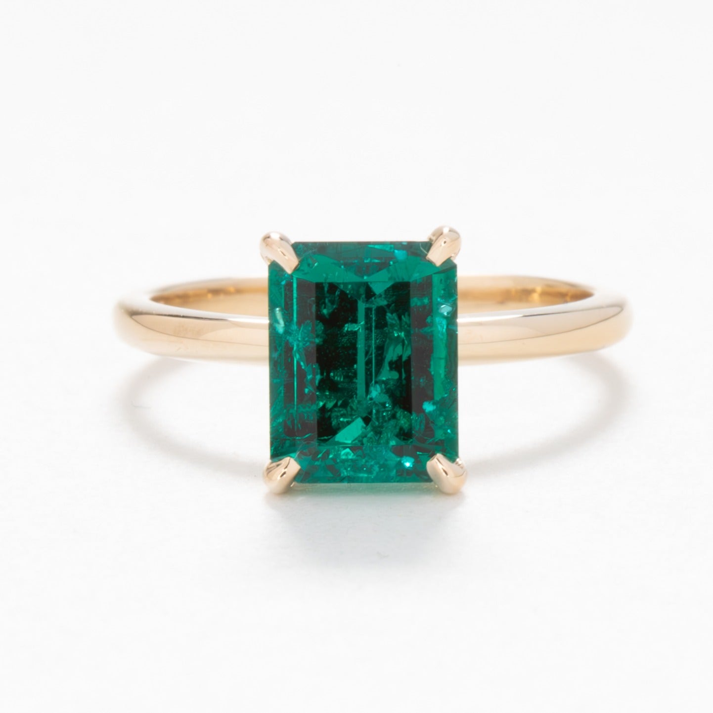 Cali solitaire engagement ring with lab emerald