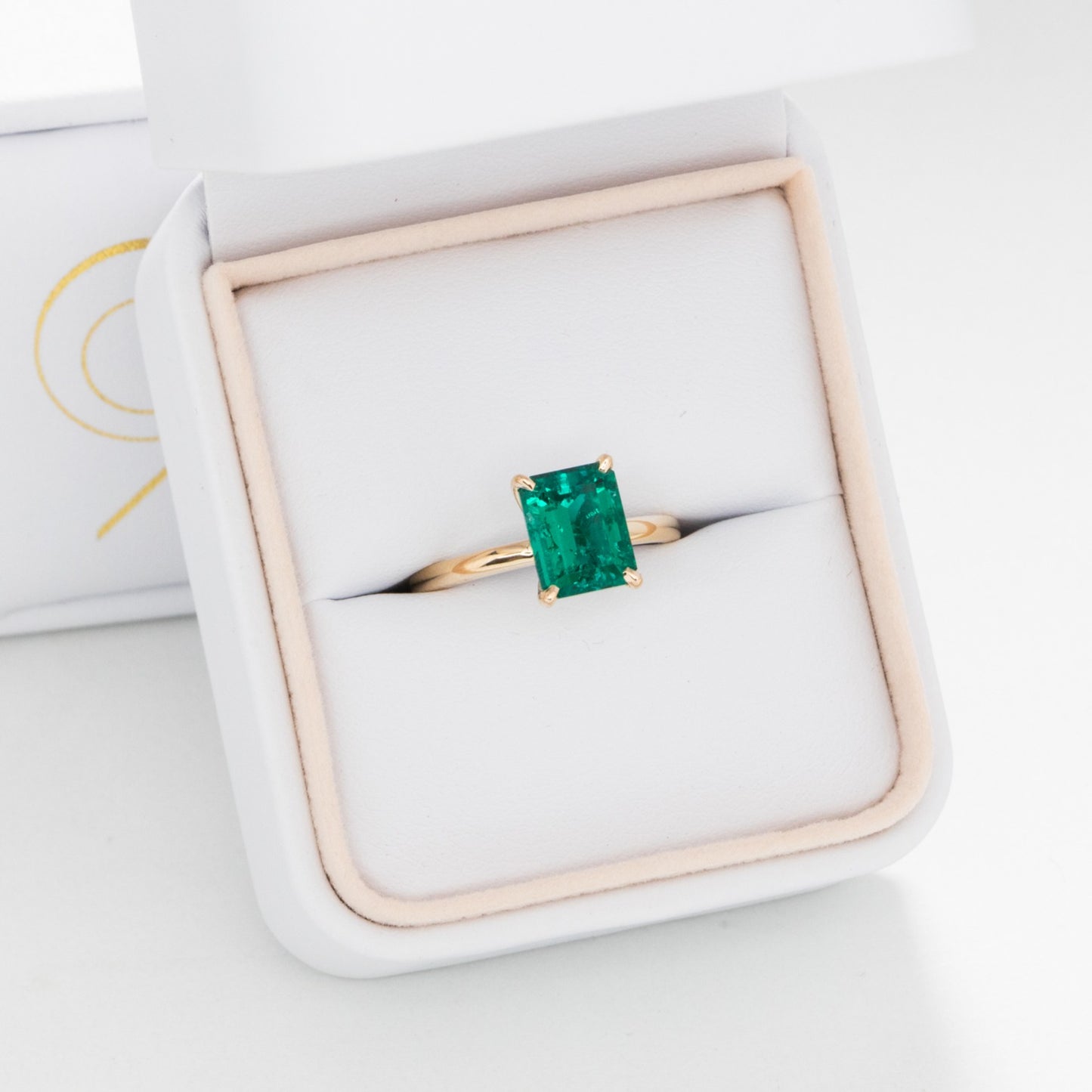 Cali solitaire engagement ring with lab emerald