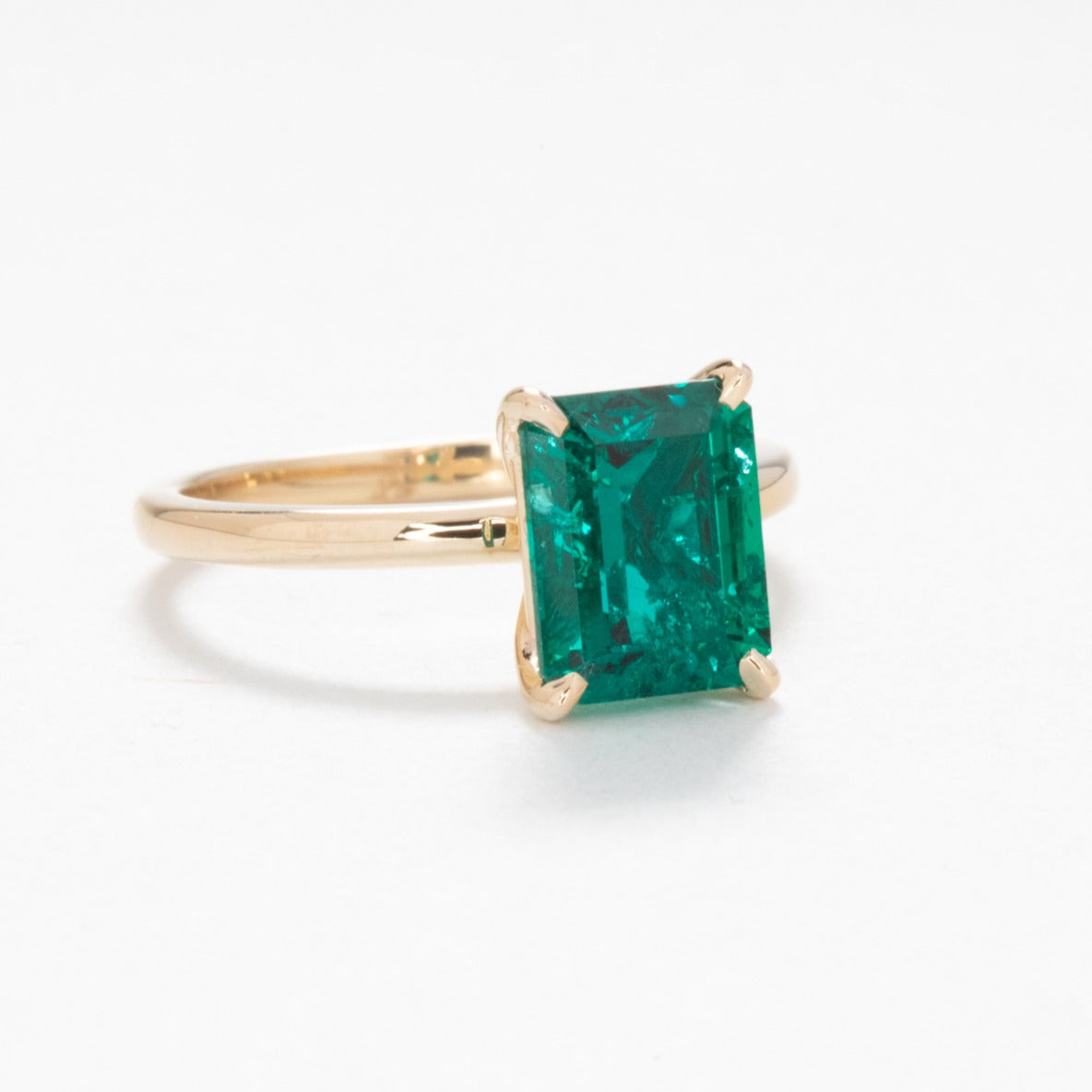 Cali solitaire engagement ring with lab emerald