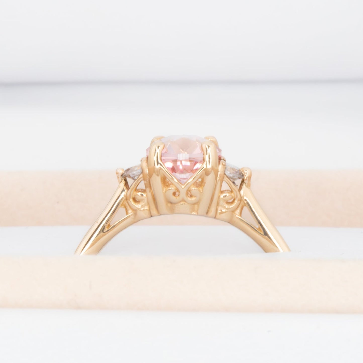 Carina ring with peach lab sapphire in yellow gold