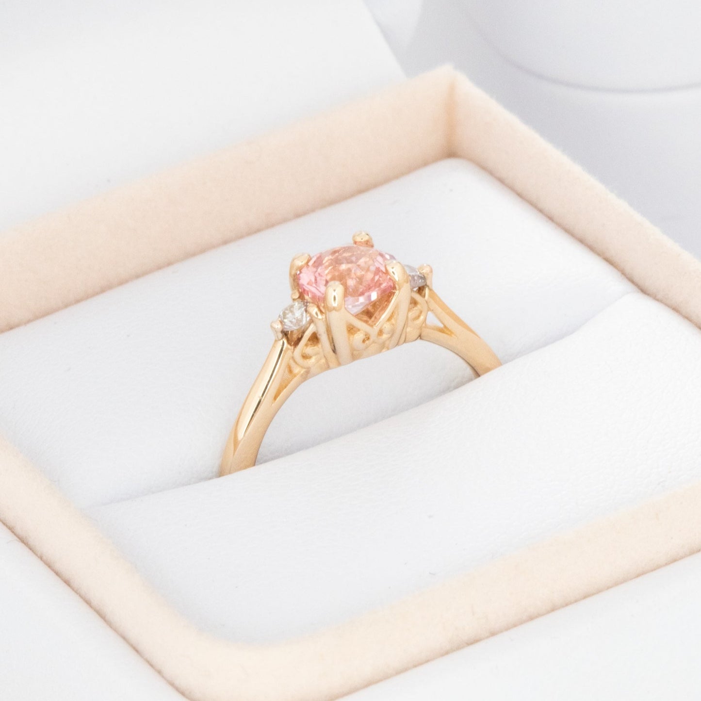 Carina ring with peach lab sapphire in yellow gold