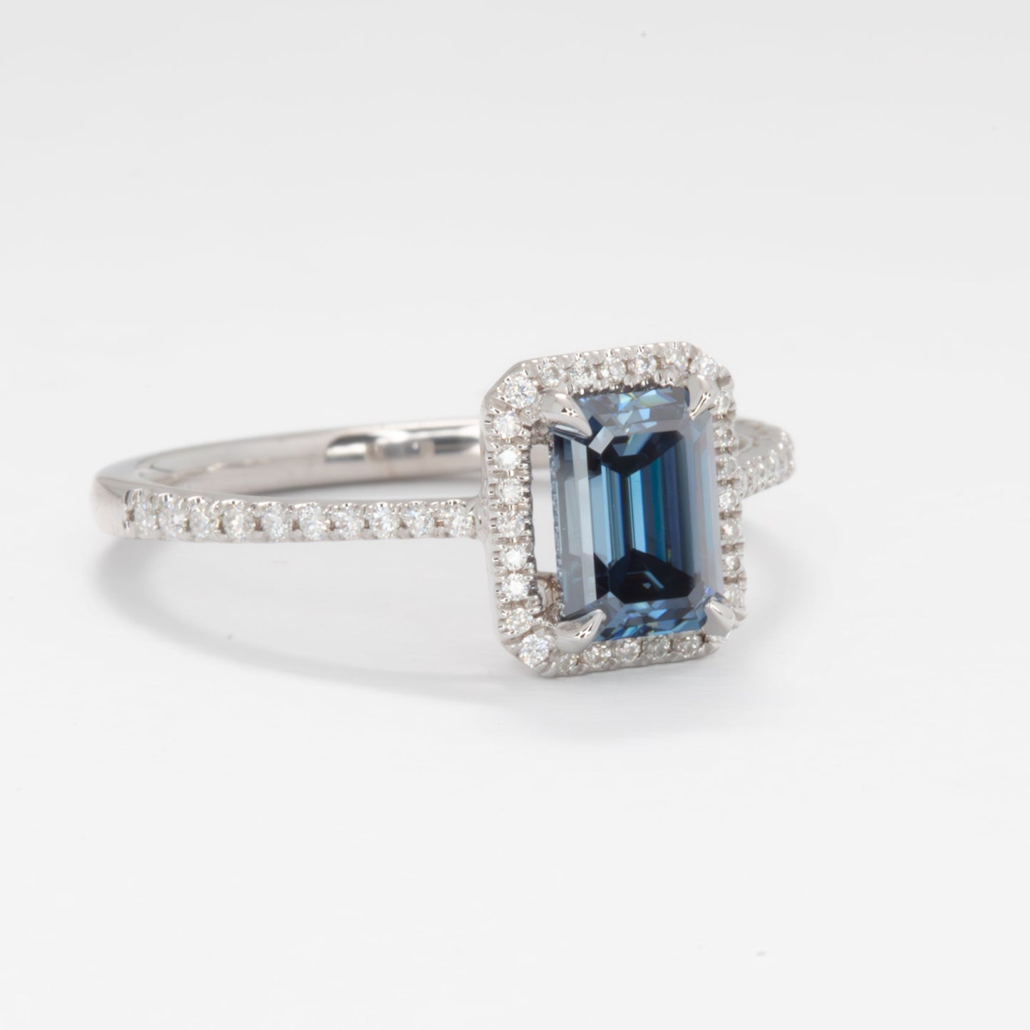 Cori engagement ring with emerald cut blue moissanite