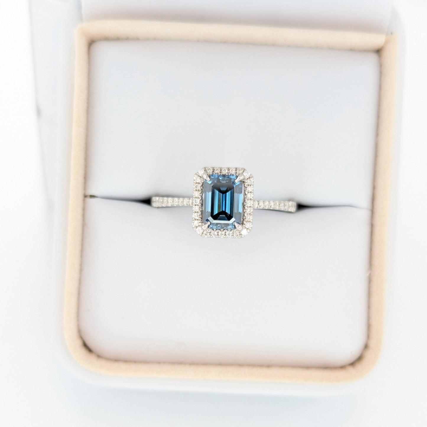 Cori engagement ring with emerald cut blue moissanite