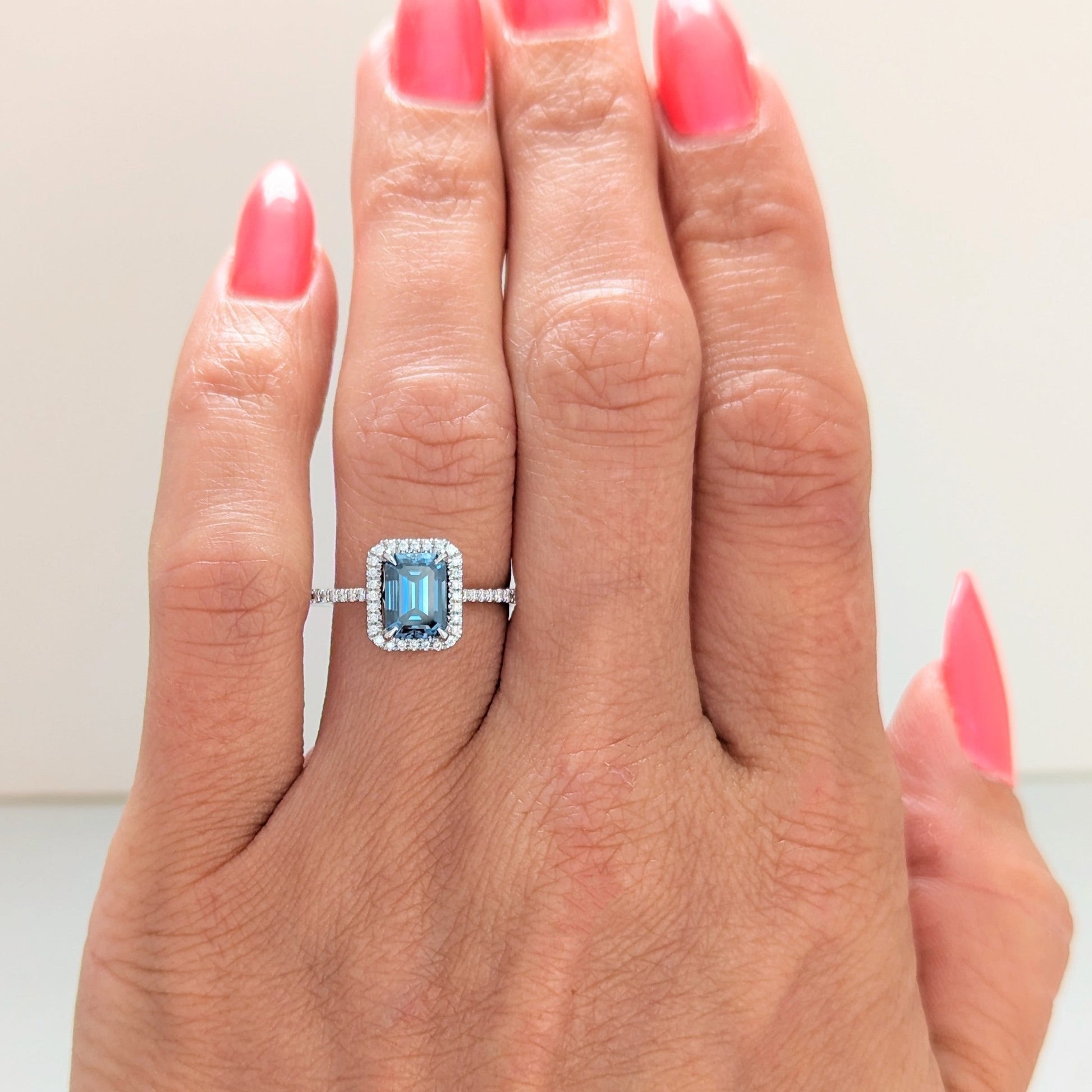 Cori engagement ring with emerald cut blue moissanite