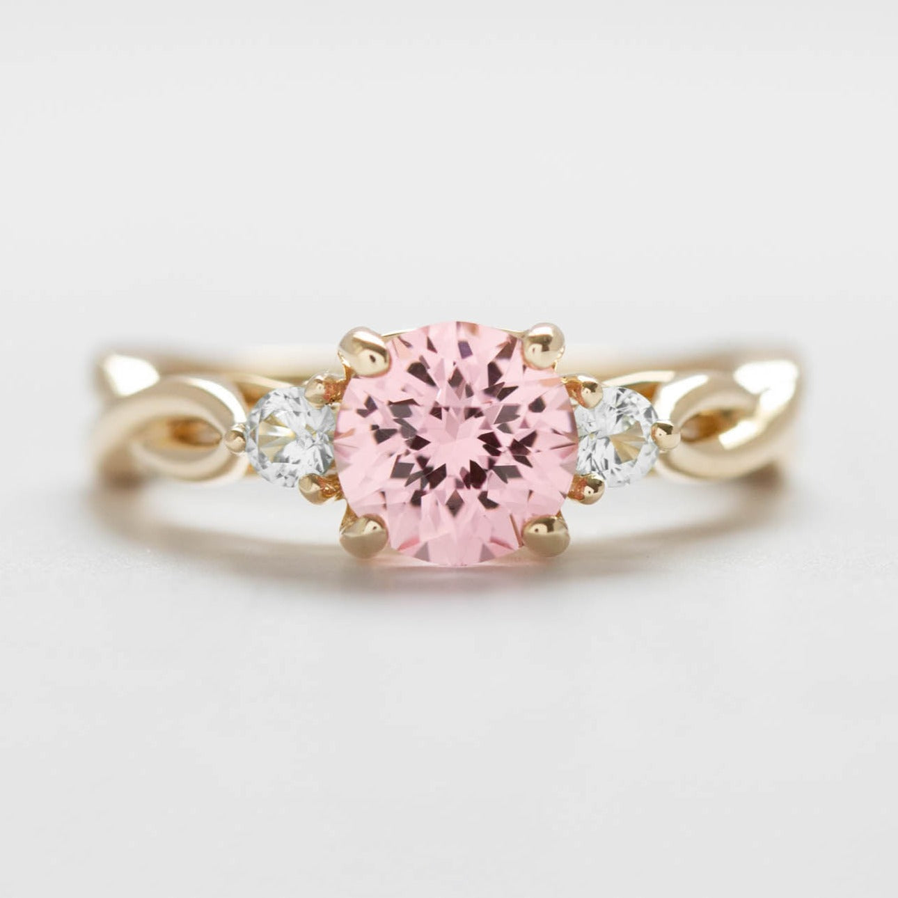 Ines three stone engagement ring with lab diamonds and pink lab sapphire