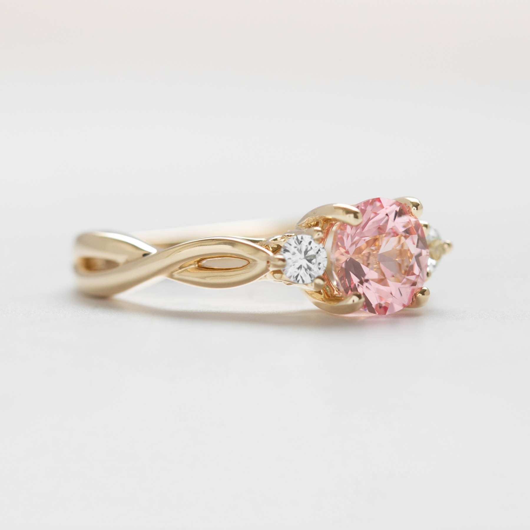 Ines three stone engagement ring with lab diamonds and pink lab sapphire