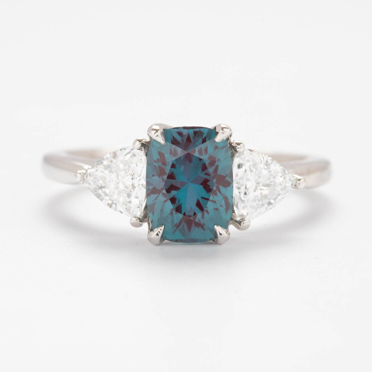 Maeve engagement ring with trillion lab diamonds and cushion alexandrite