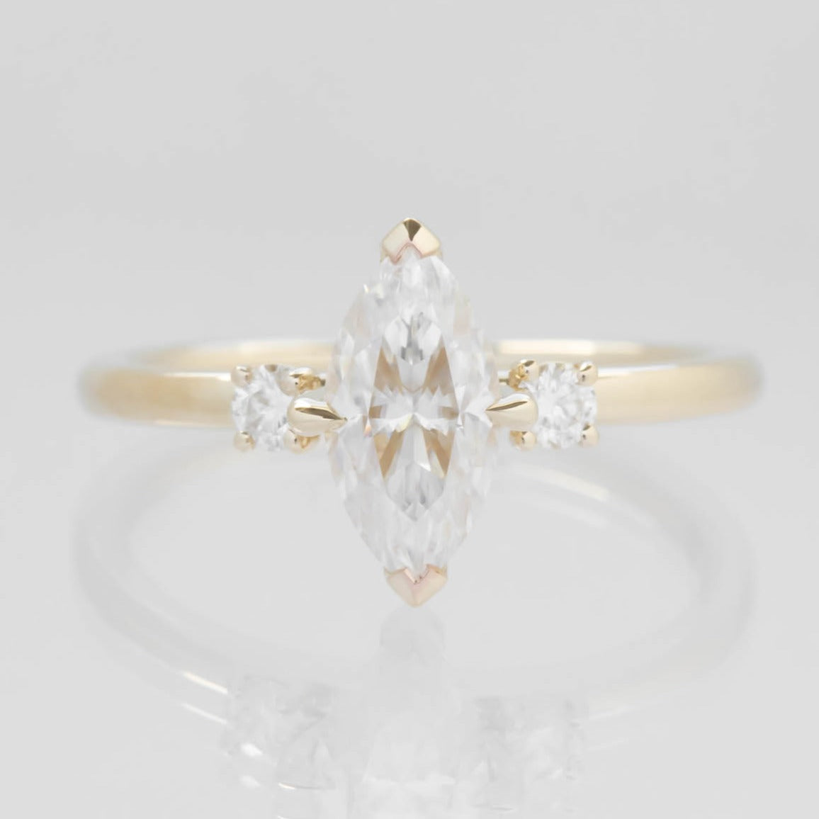 Mila three stone engagement ring with moissanite marquise