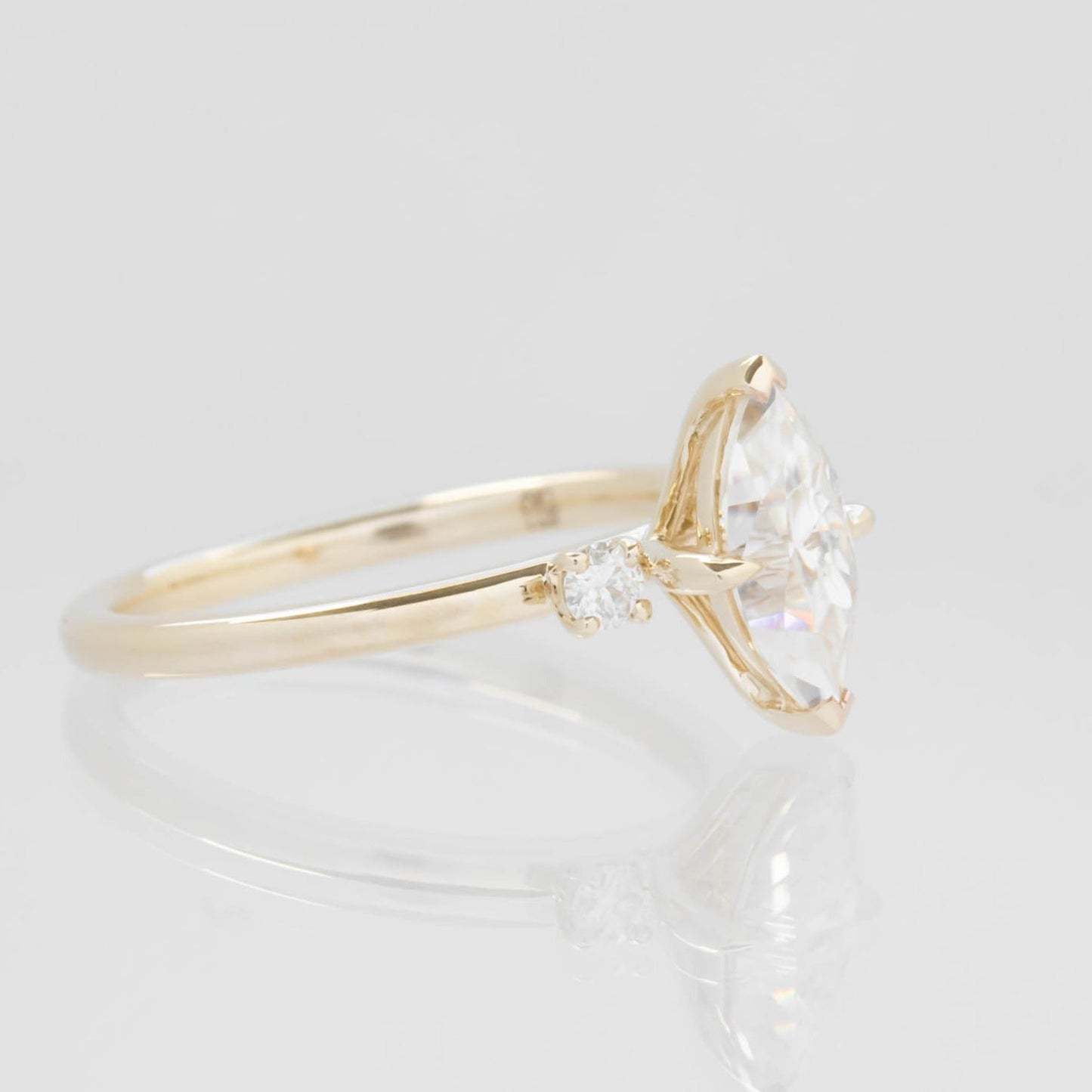 Mila three stone engagement ring with moissanite marquise