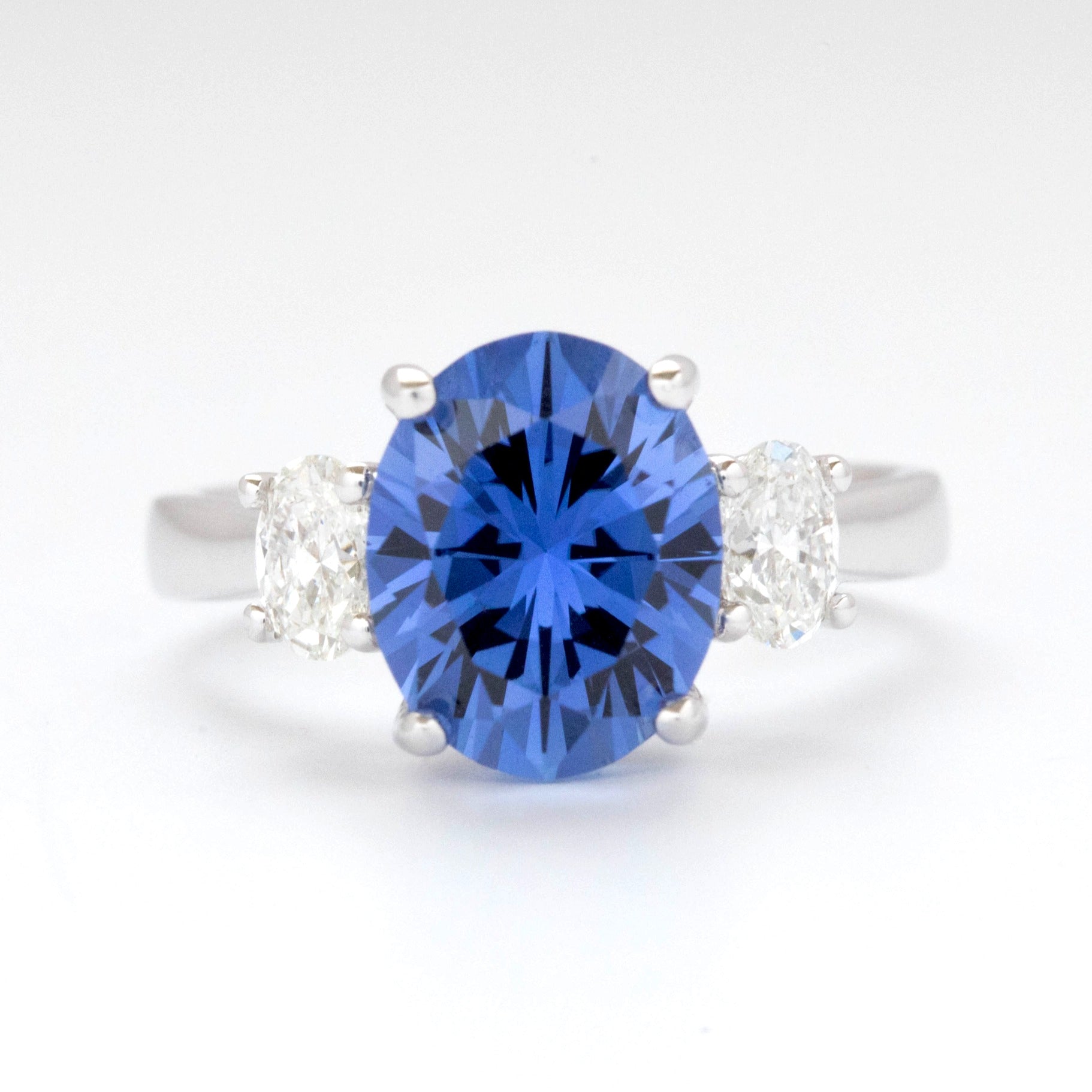 milly three stone ring with oval blue lab sapphire