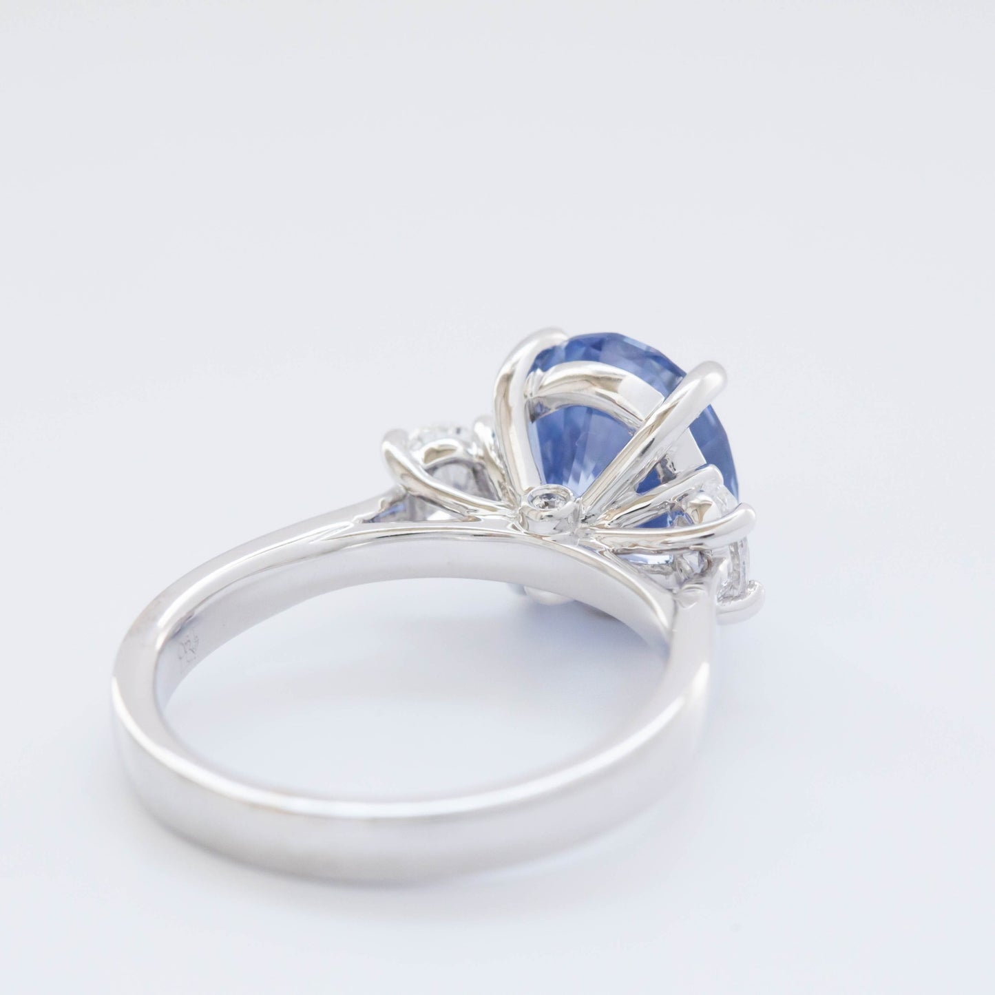 Milly three stone engagement ring with oval blue lab sapphire