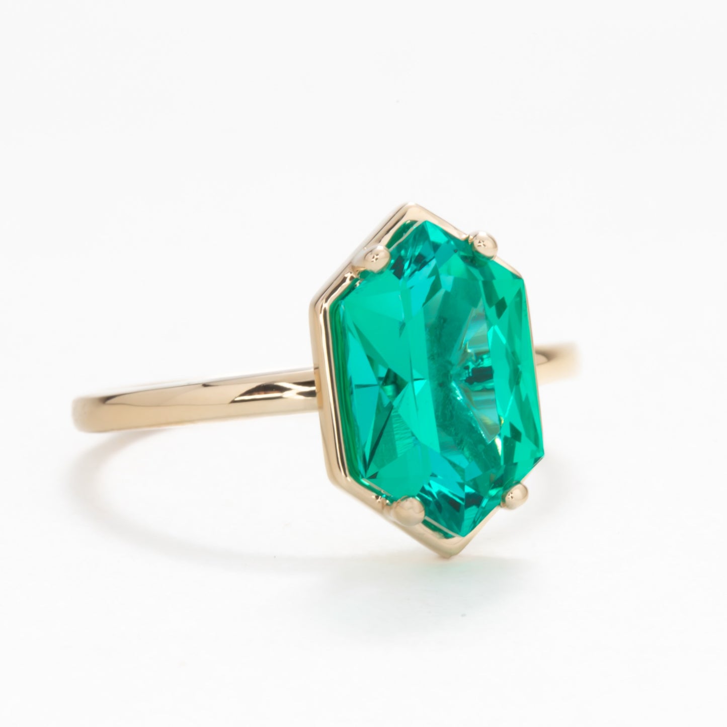 Paris solitaire engagement ring with dutch marquise lab emerald