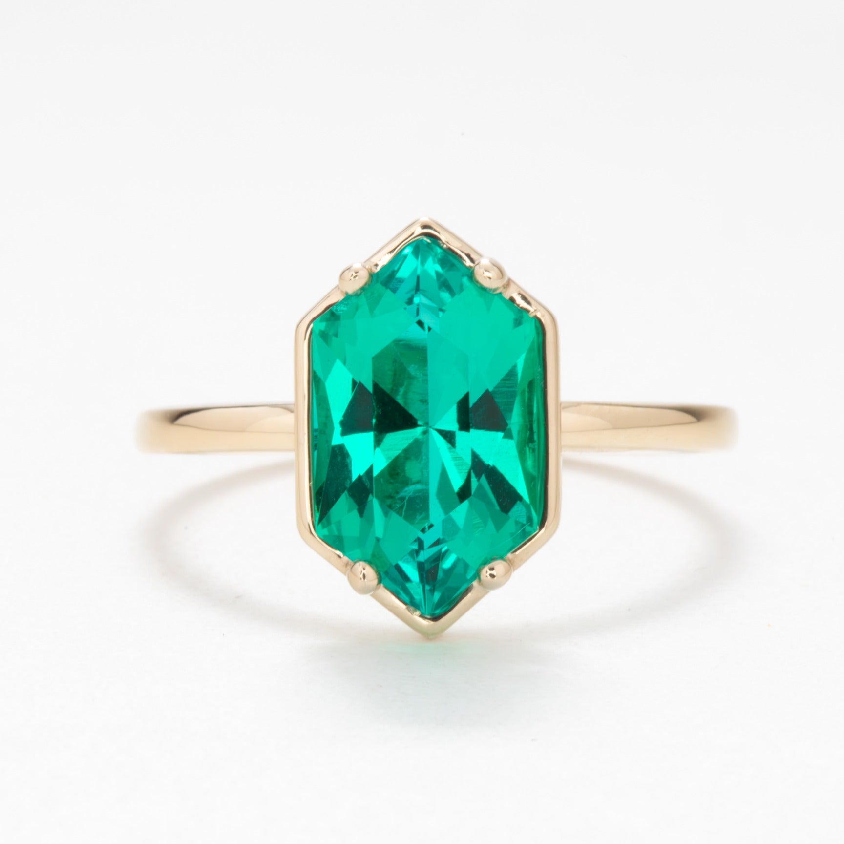 Paris solitaire engagement ring with dutch marquise lab emerald