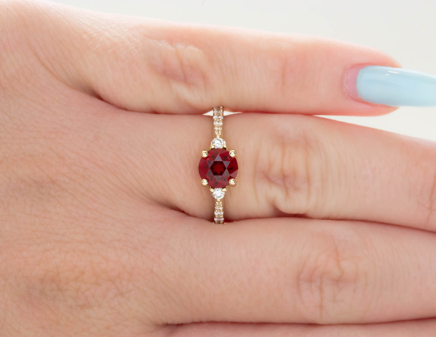 Stacy three stone engagement ring with lab ruby