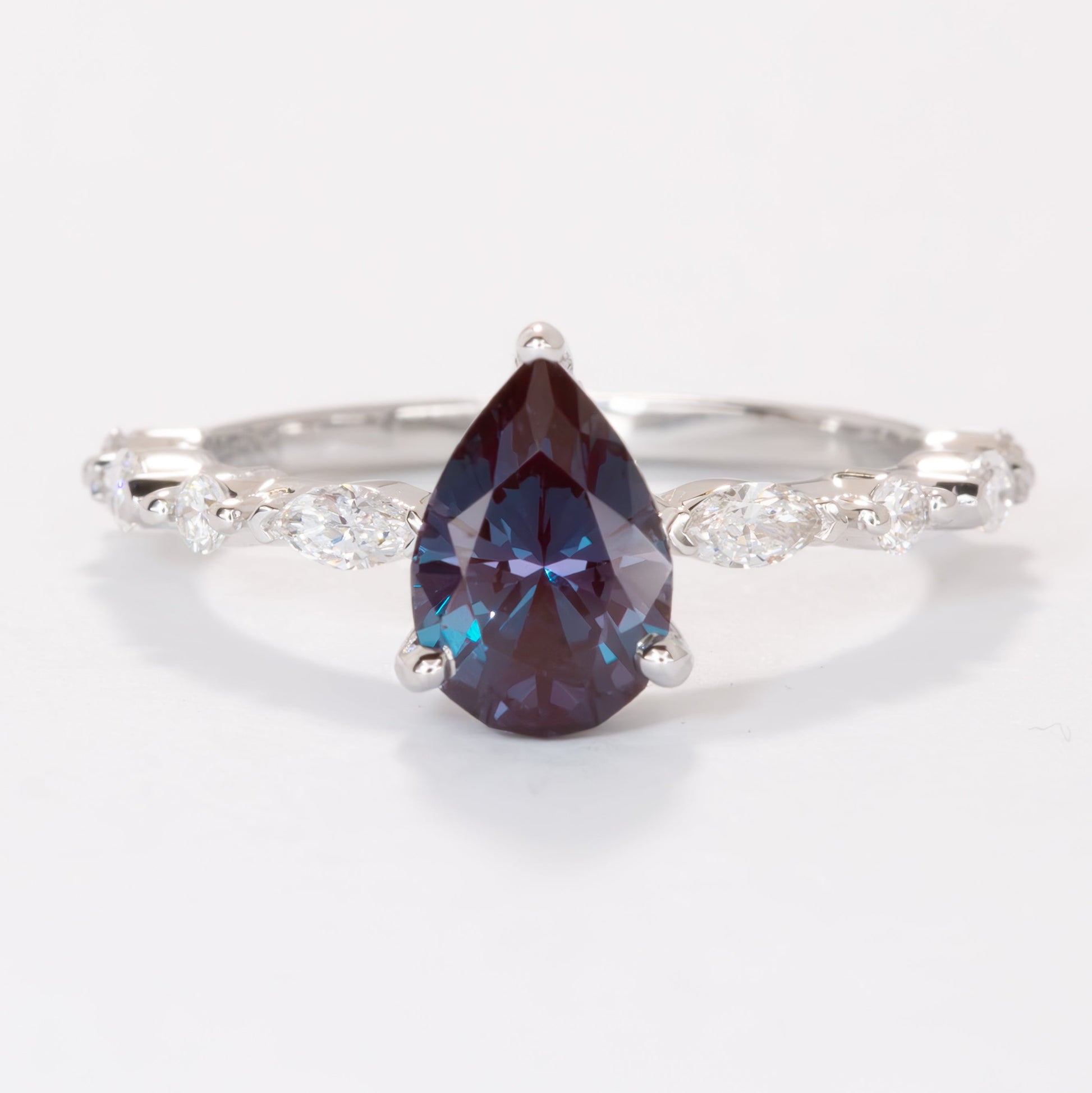 Wren engagement ring with lab diamonds and pear lab alexandrite