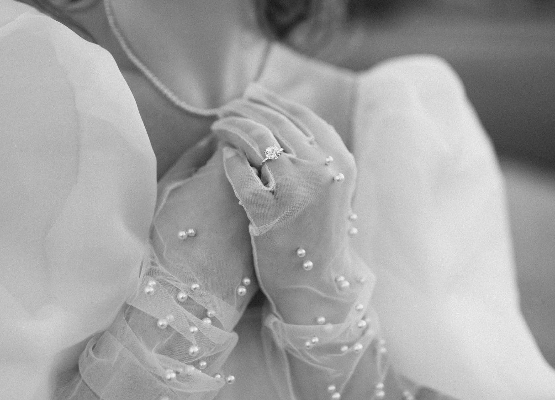 black and white wedding gloves with engagement ring