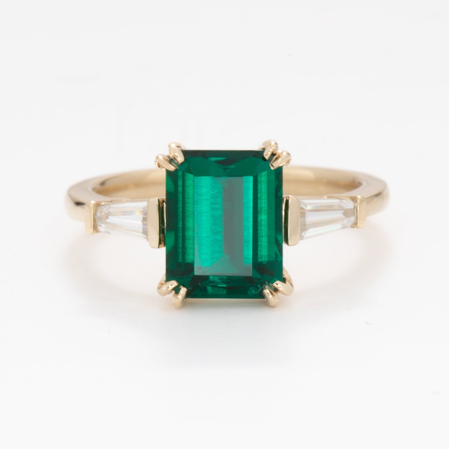 elyna three stone engagement ring with lab emerald