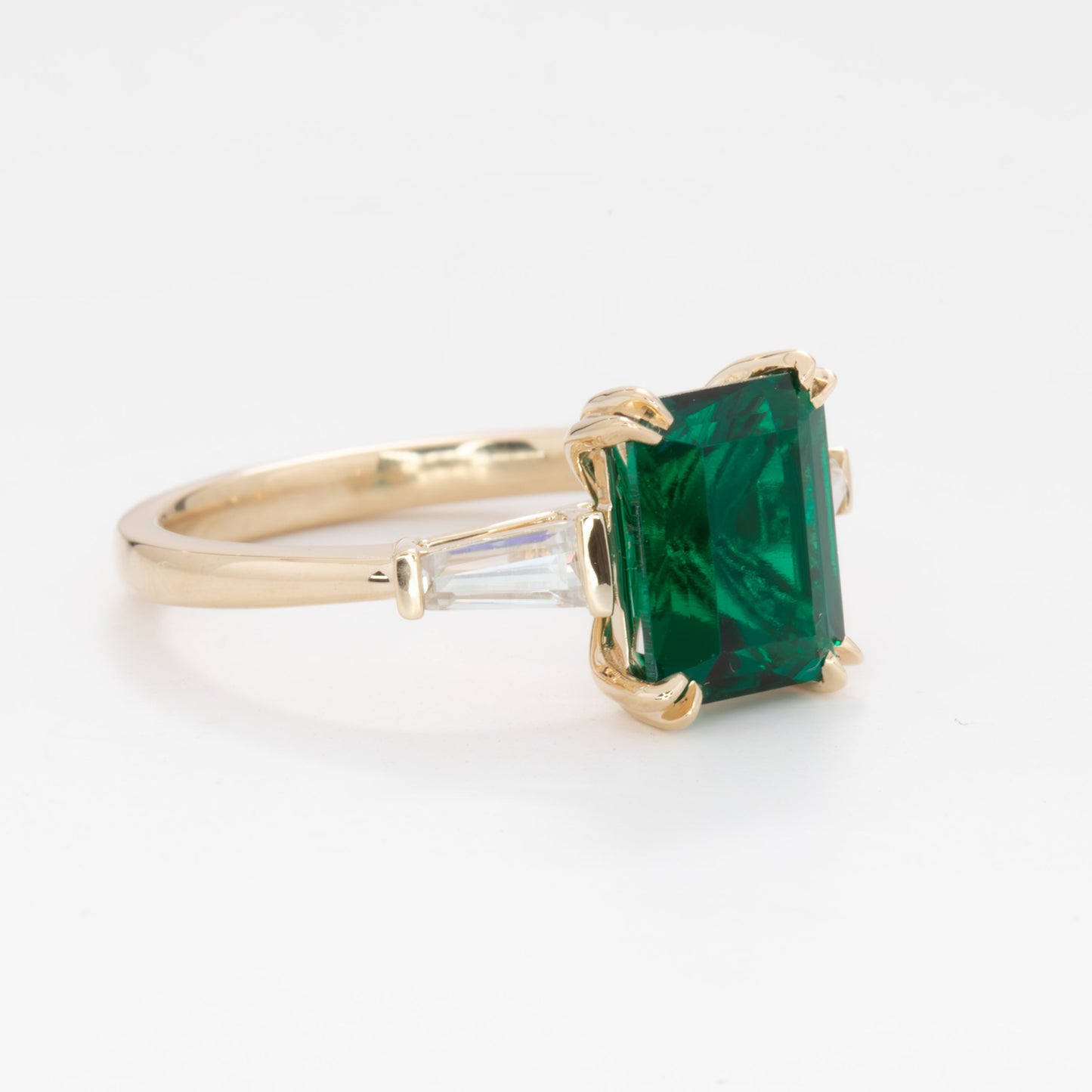 elyna three stone engagement ring with lab emerald