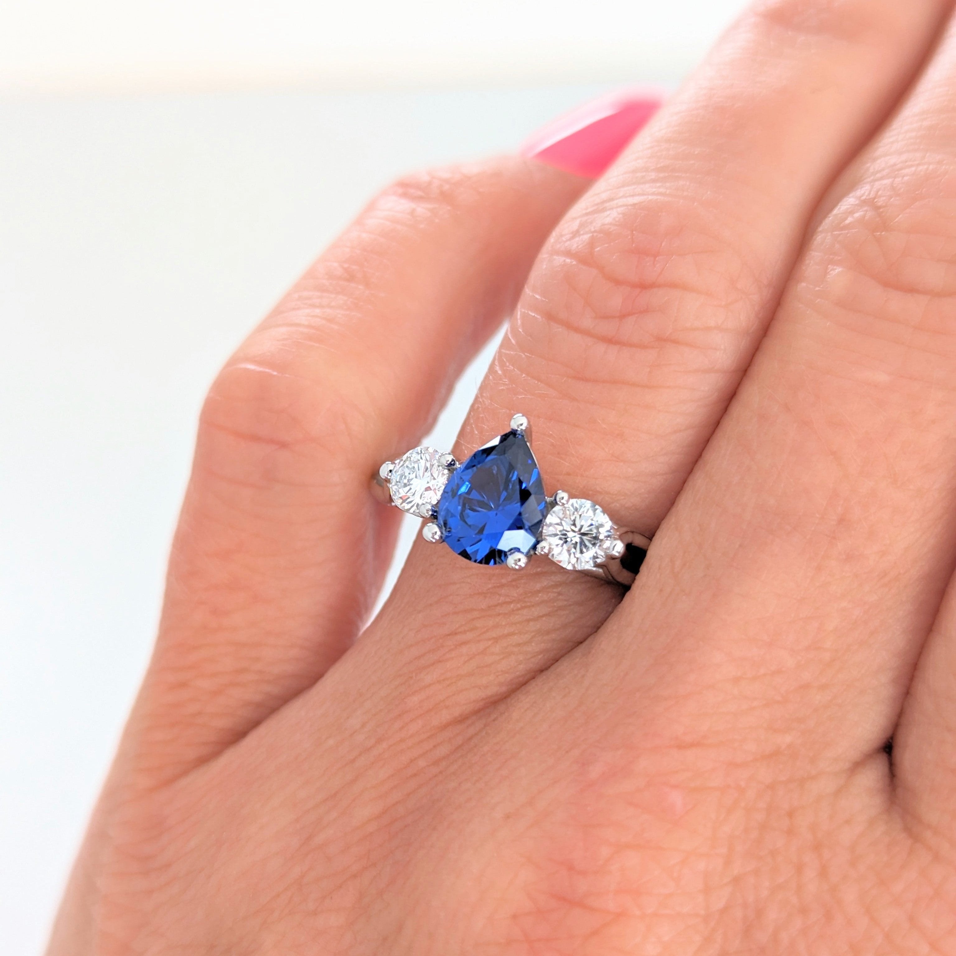 emryn three stone engagement ring with pear blue lab sapphire