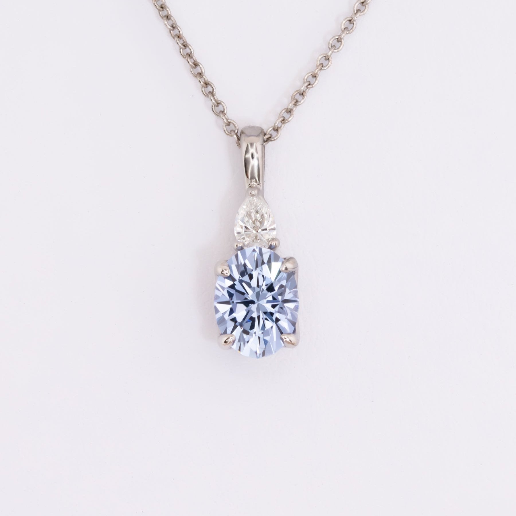 esther necklace in white gold with blue oval lab sapphire