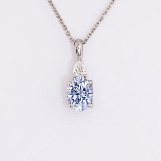 esther necklace in white gold with blue oval lab sapphire 