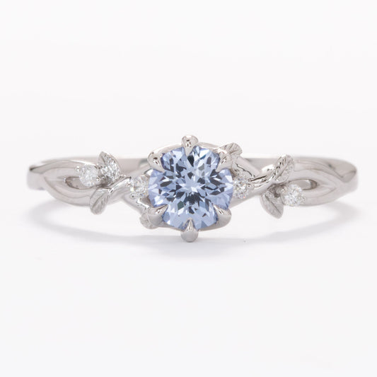 floral inspired lillian ring with light blue lab sapphire round