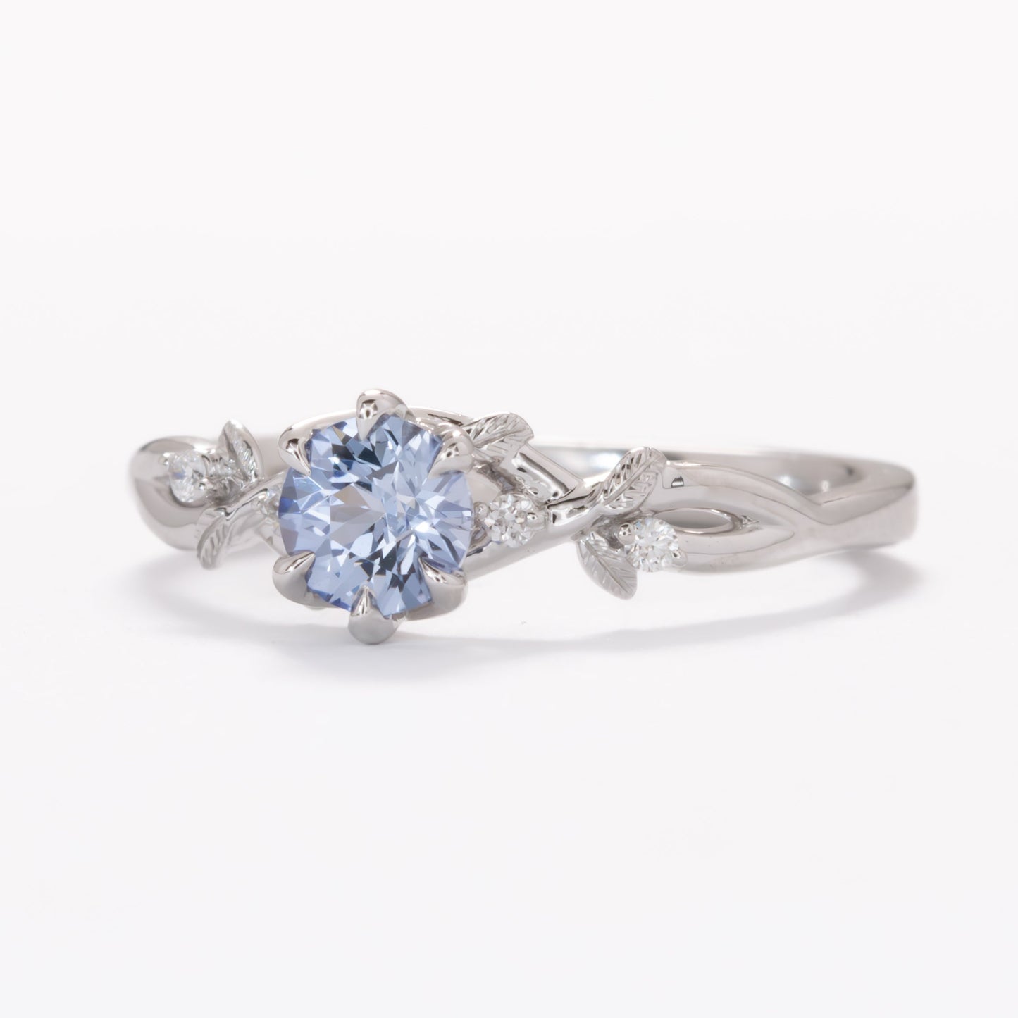 floral inspired lillian ring with light blue lab sapphire round