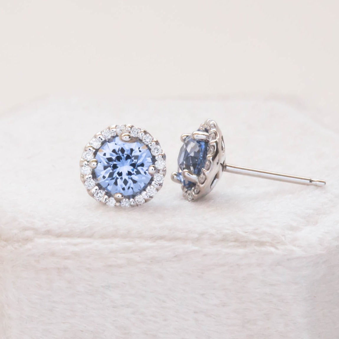 blue lab sapphire and lab diamond halo earrings