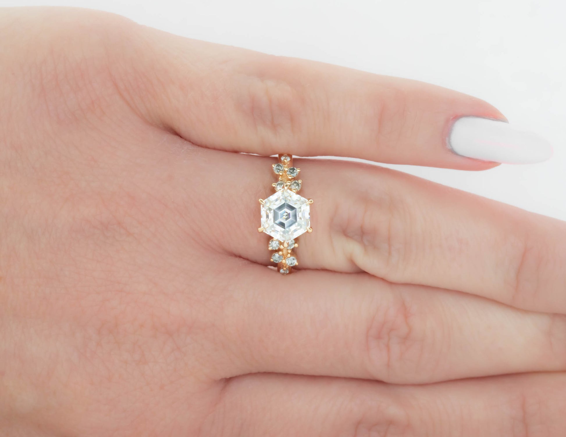 yellow gold ring with step cut hex moissanite