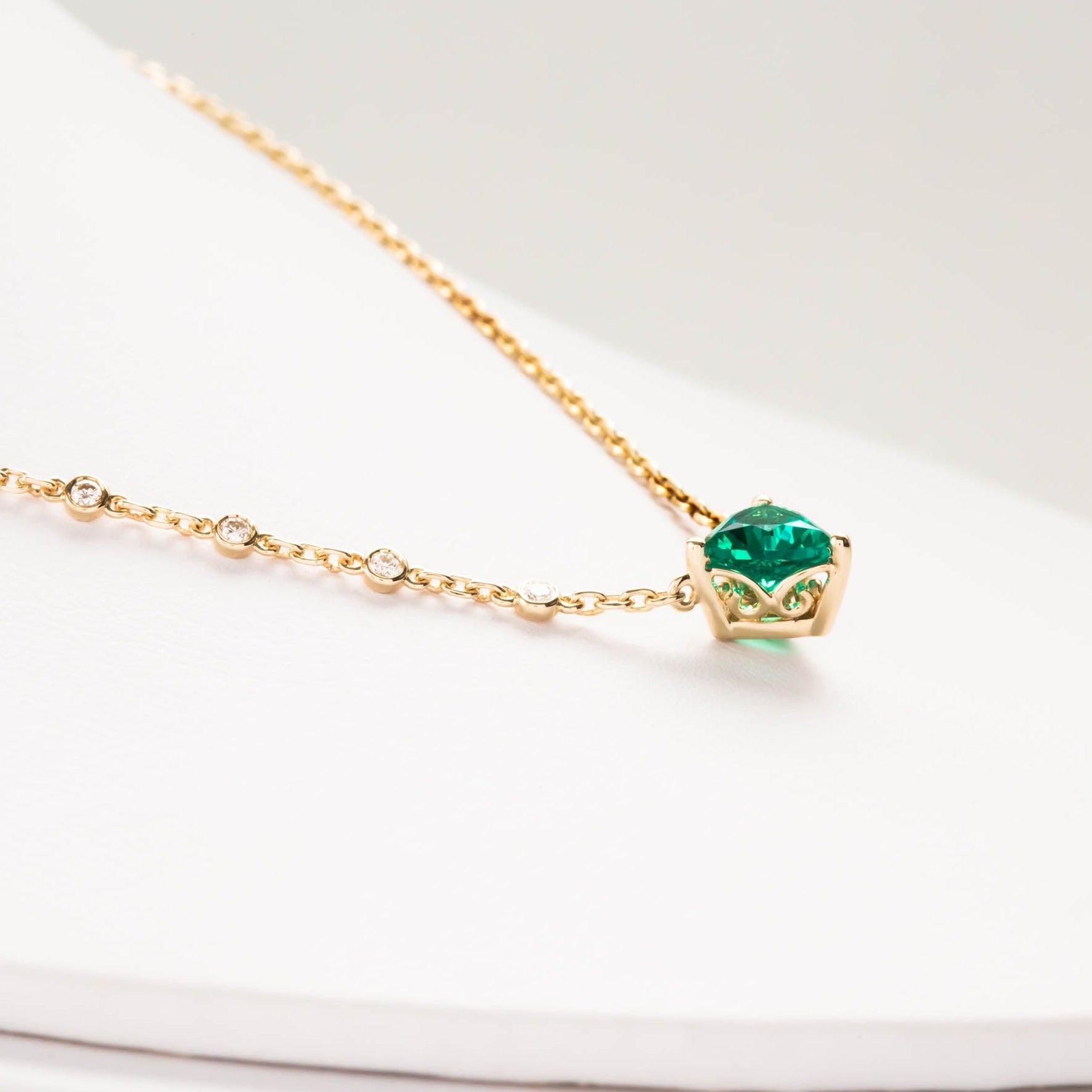 ivy necklace with trillion lab emerald