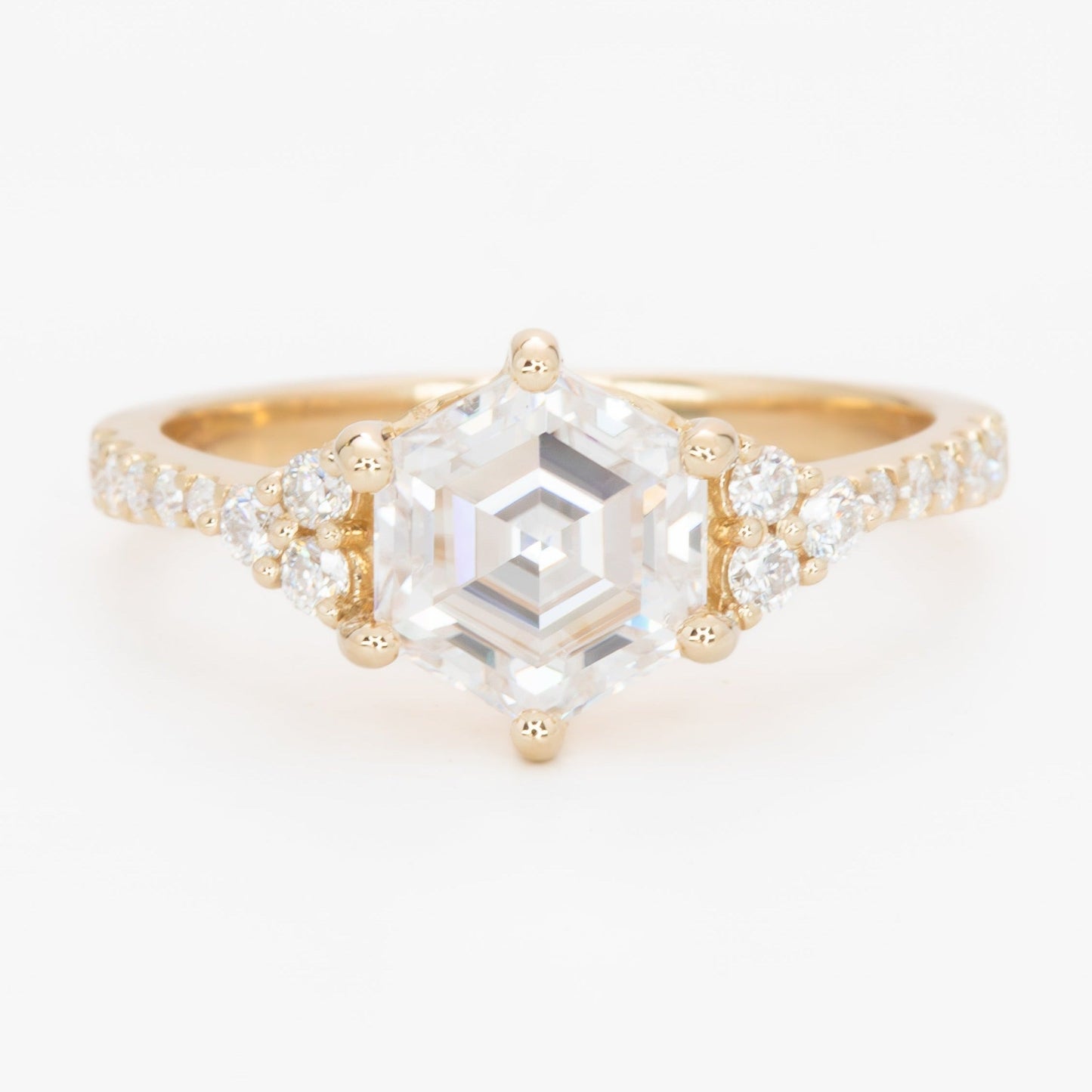 juliette engagement ring with yellow gold and hex cut moissanite 