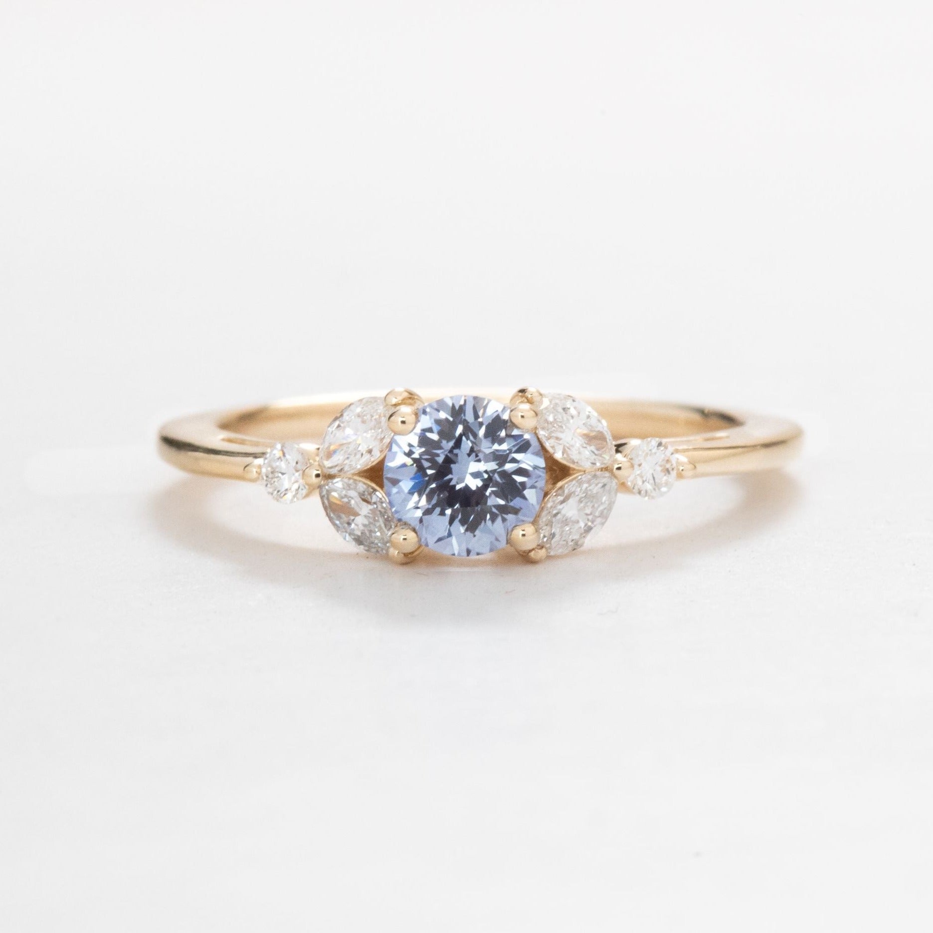 lili floral engagement ring with blue sapphire