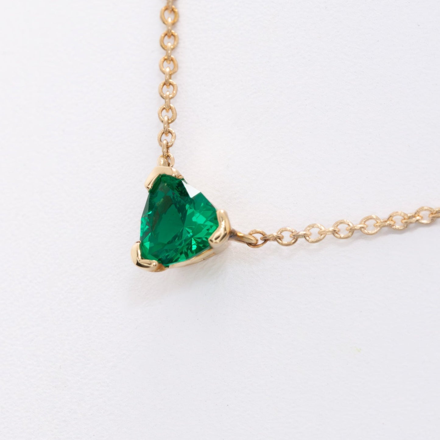 llew trillion necklace with lab emerald