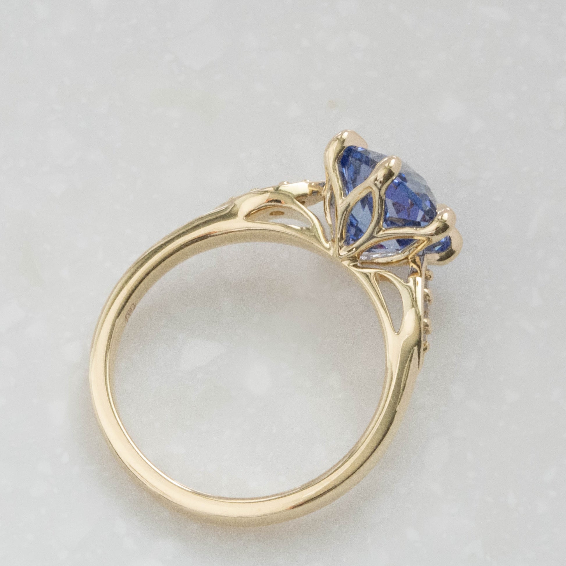 nature inspired engagement ring with hex cut blue lab ssapphire