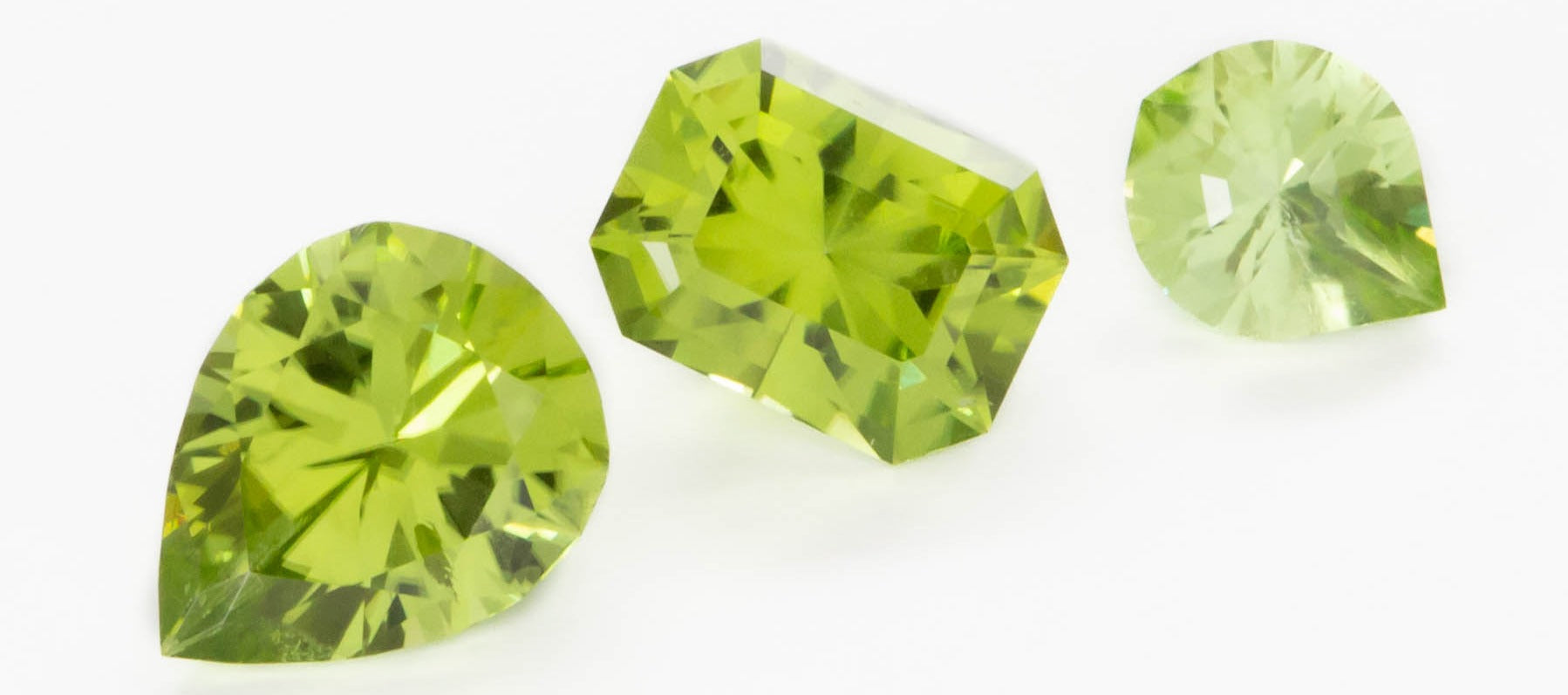 bright green peridot pear, radiant, and maya drop pear