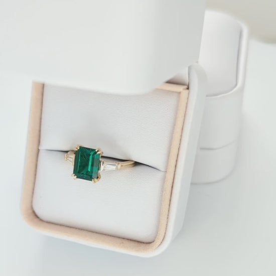 elyna three stone engagement ring with lab emerald