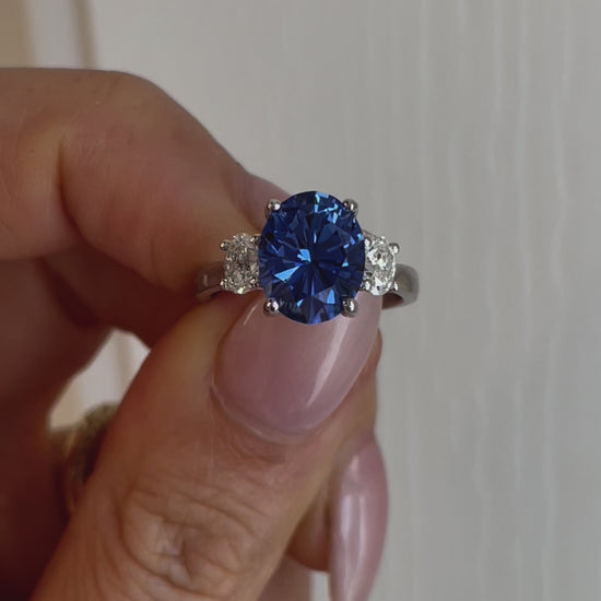 Milly three stone engagement ring with oval blue lab sapphire