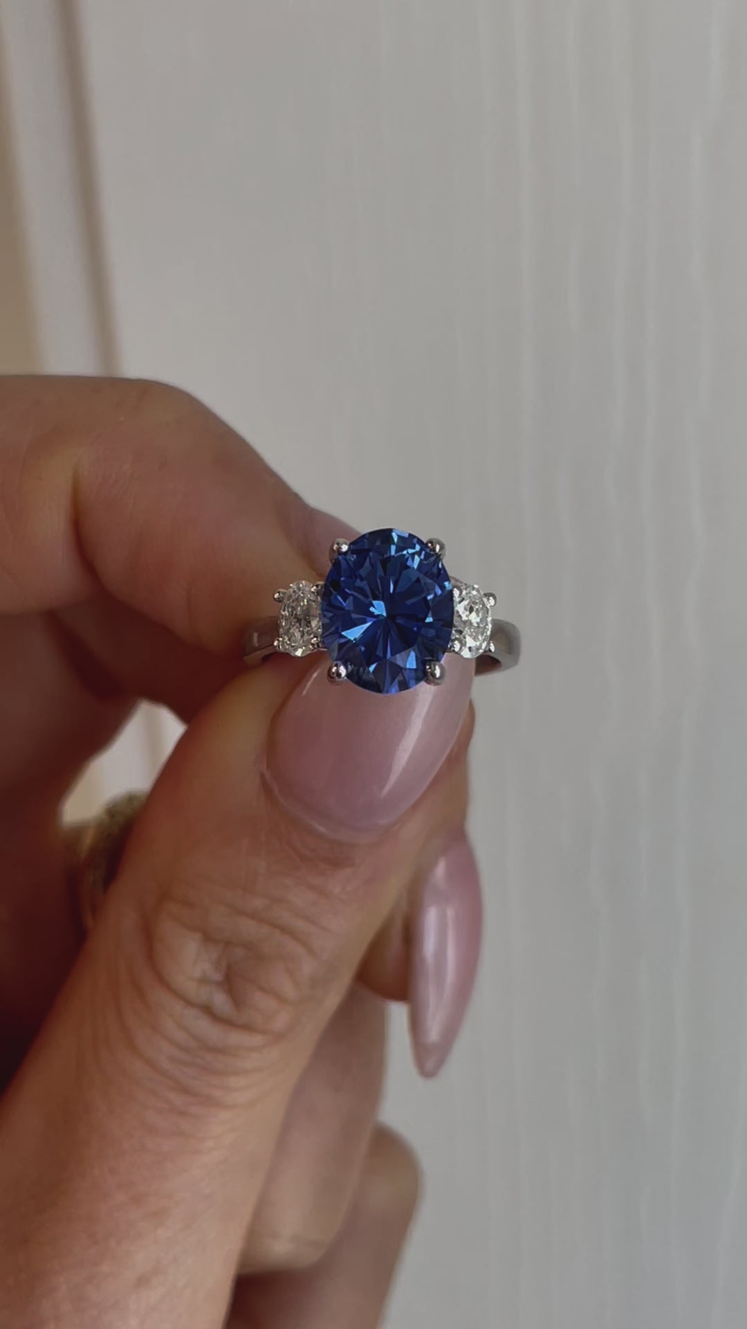 Milly three stone engagement ring with oval blue lab sapphire