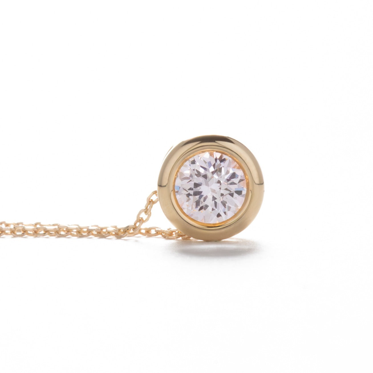 rhea necklace with pink lab sapphire in yellow gold