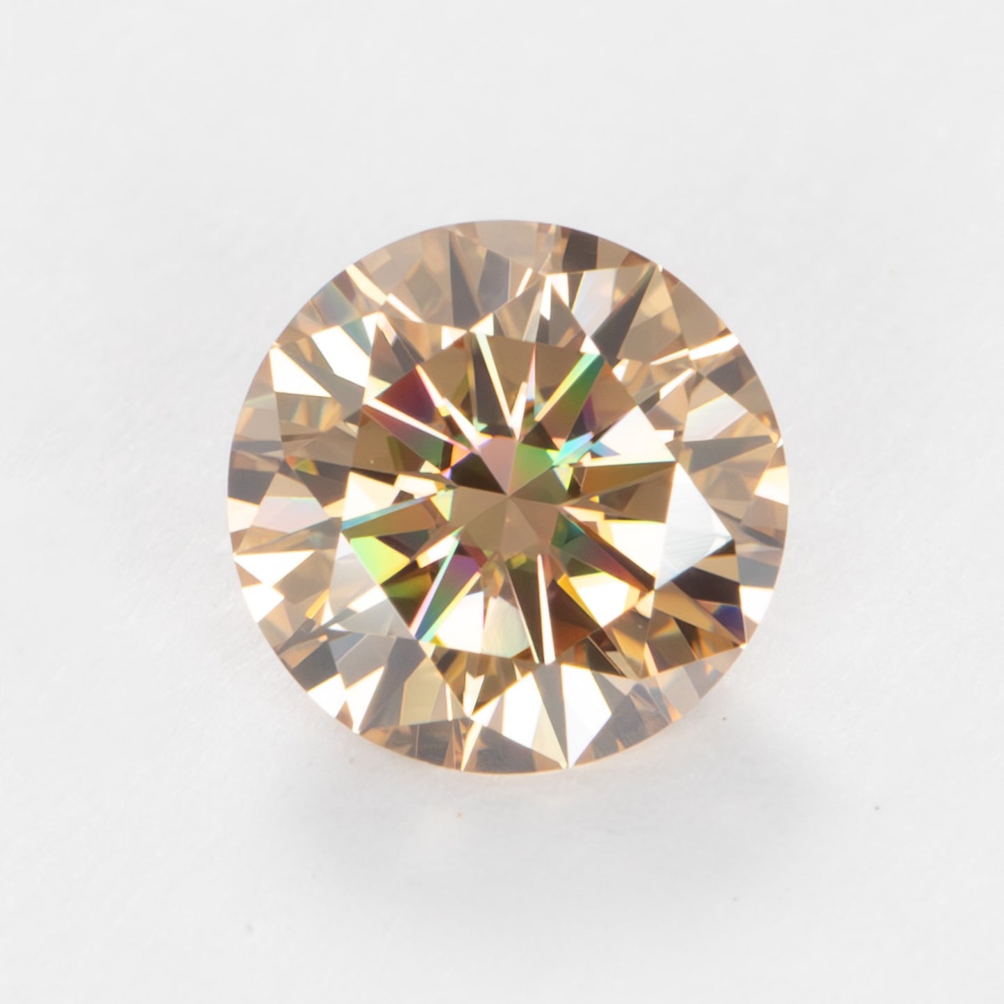 round champagne peach moissanite