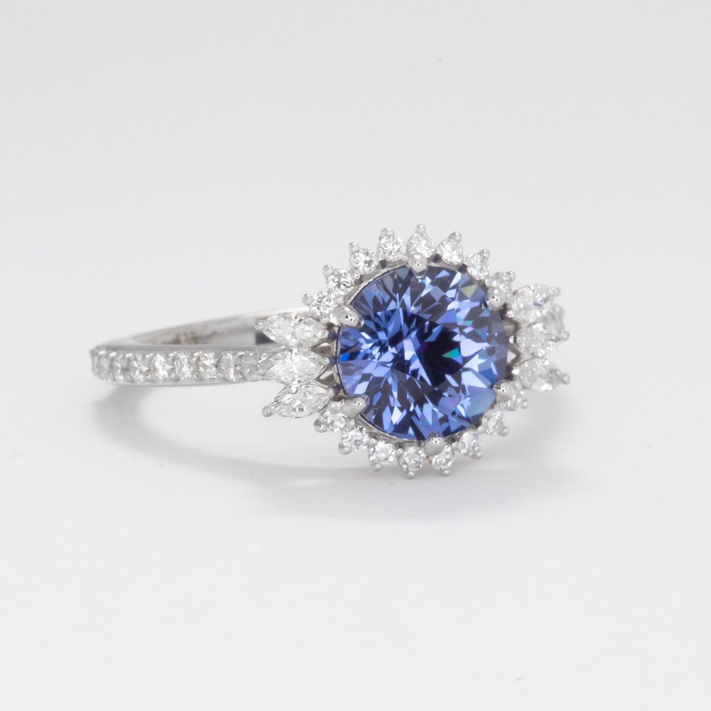 round cut blue sapphire halo engagement ring