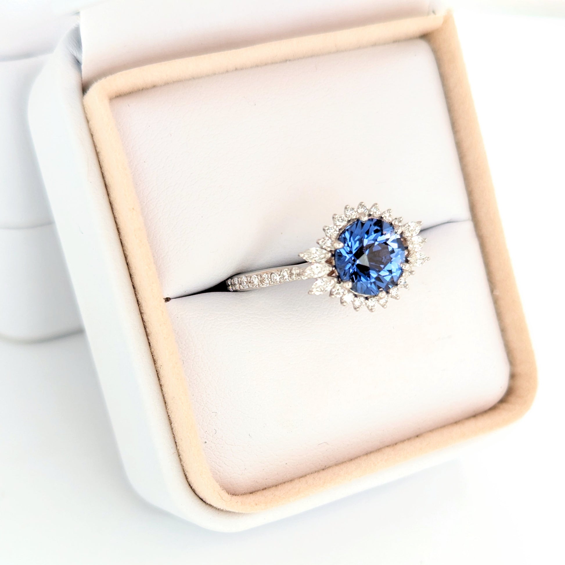 round cut blue sapphire halo engagement ring