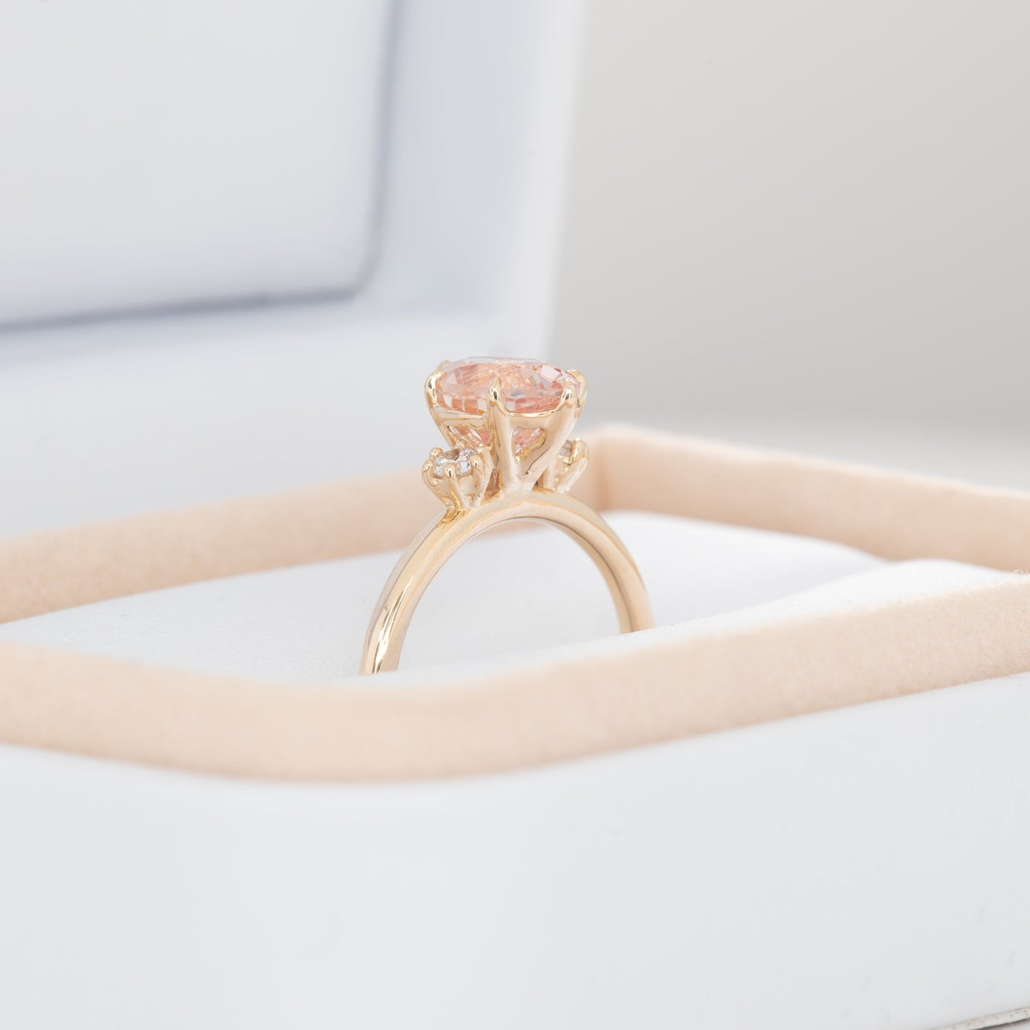 signy engagement ring with oval peach lab sapphire