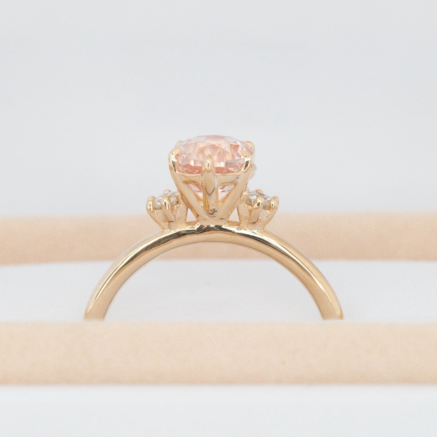 signy engagement ring with oval peach lab sapphire