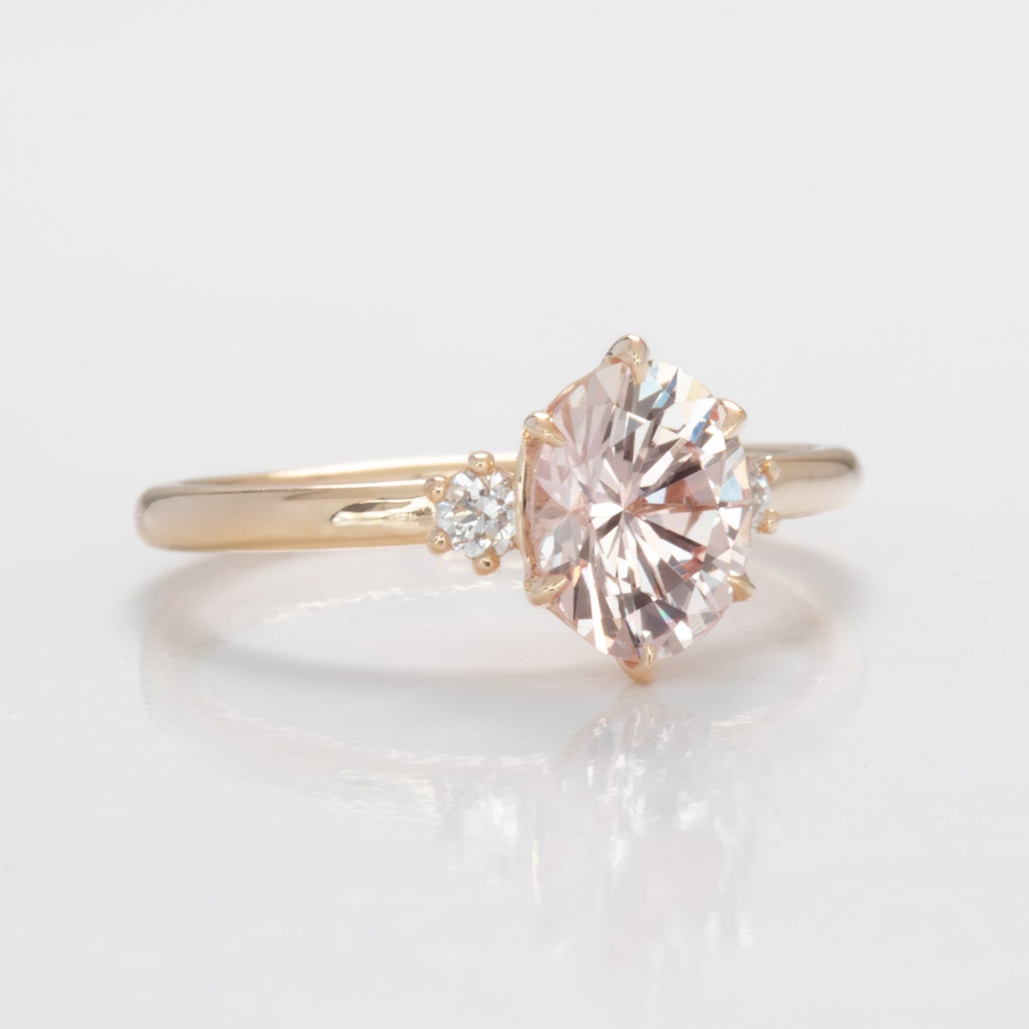 signy engagement ring with oval peach lab sapphire