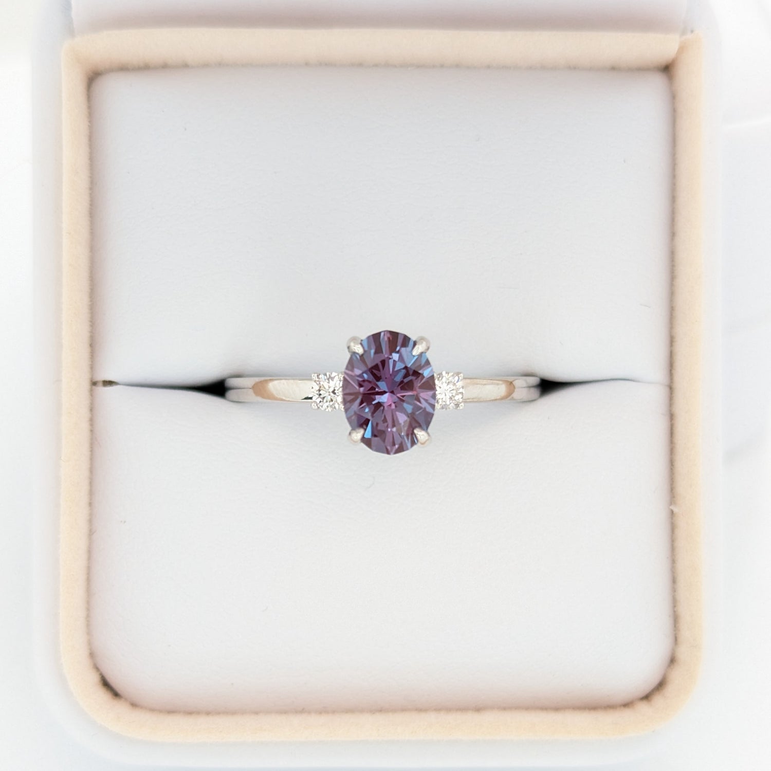 three stone ring with lab alexandrite oval