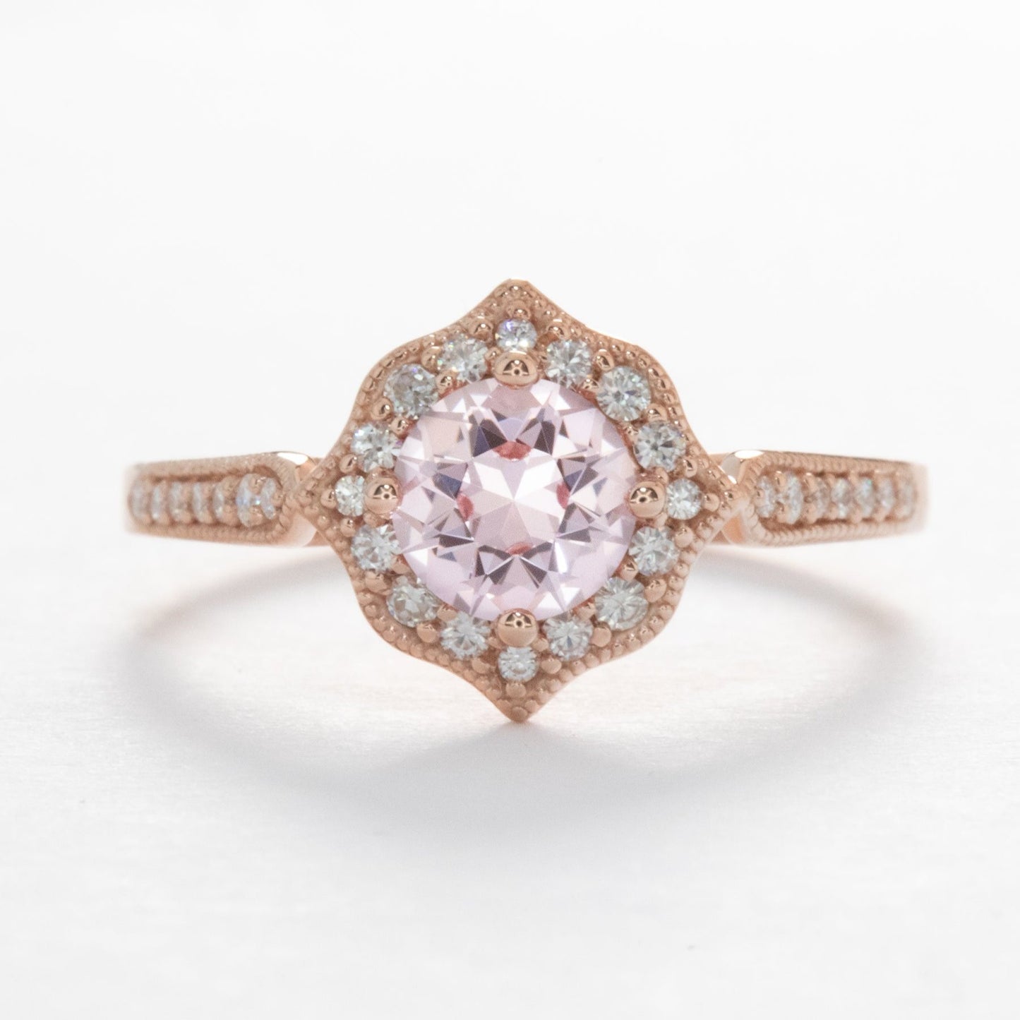 violet engagement ring with peach lab sapphire round in rose gold