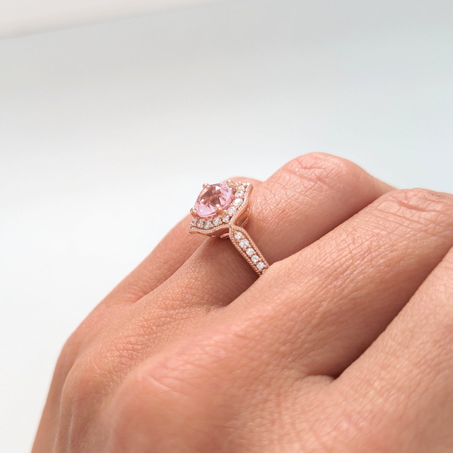 violet engagement ring with peach lab sapphire round in rose gold